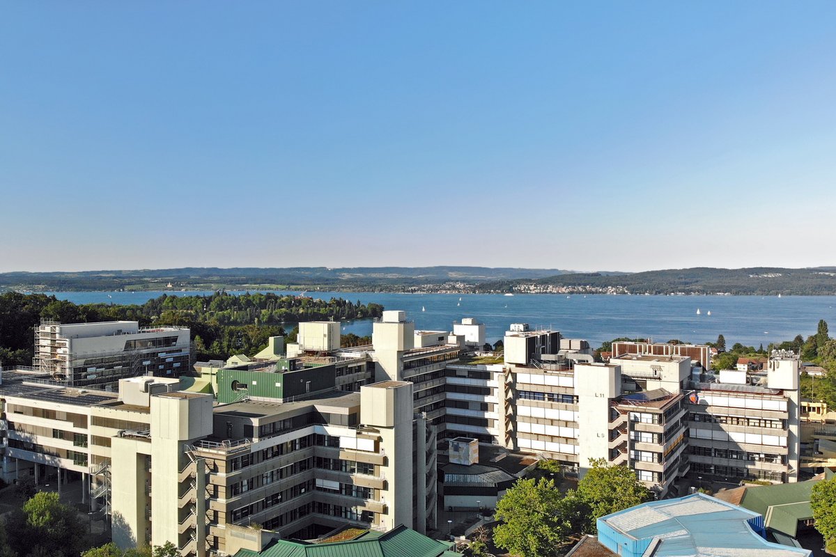 Aerial view of the University of Konstanz with Lake Constance and the Mainau Island in the background.